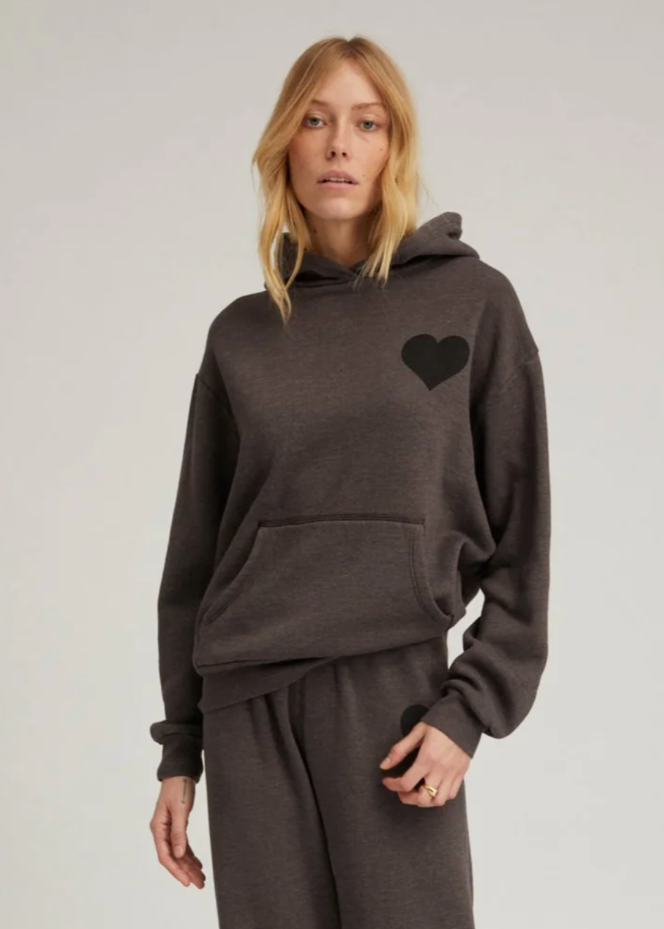 Person wearing SPRWMN Heart Hoodie in Charcoal