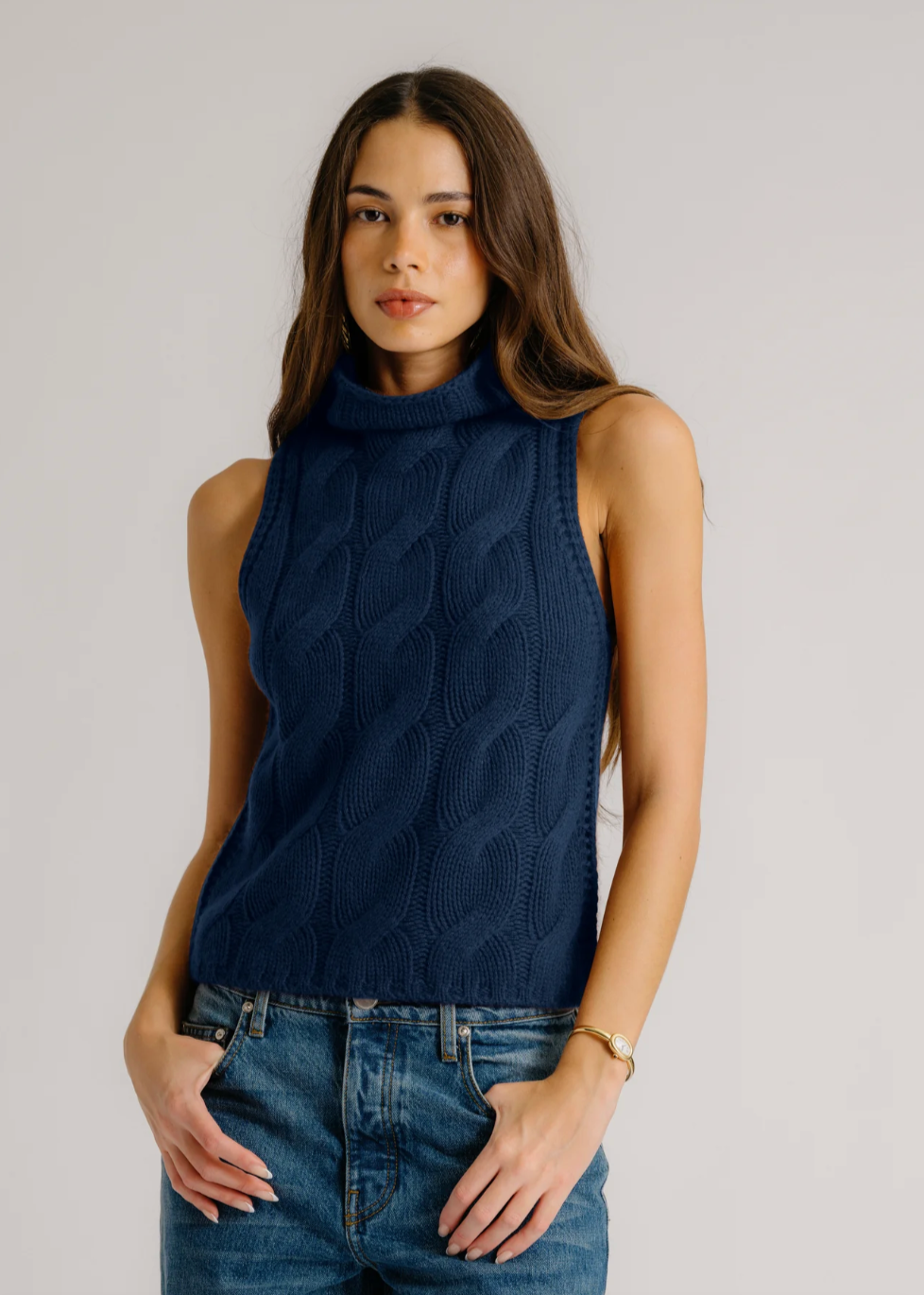 Person wearing Sablyn Salvia Sleeveless Cashmere Turtleneck in Midnight Navy