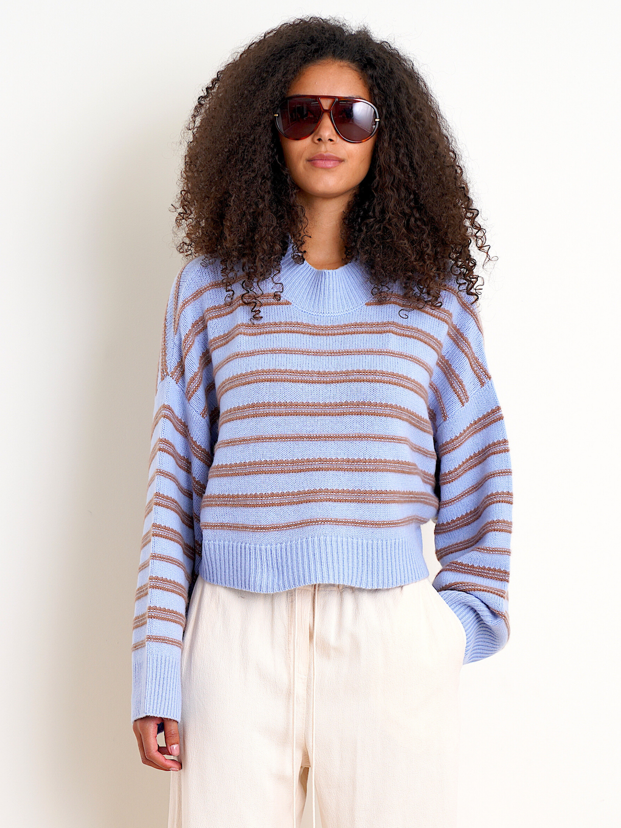 Person wearing Sablyn Wells B Cropped Long Sleeve Striped Pullover in AZUREOUS MULTI