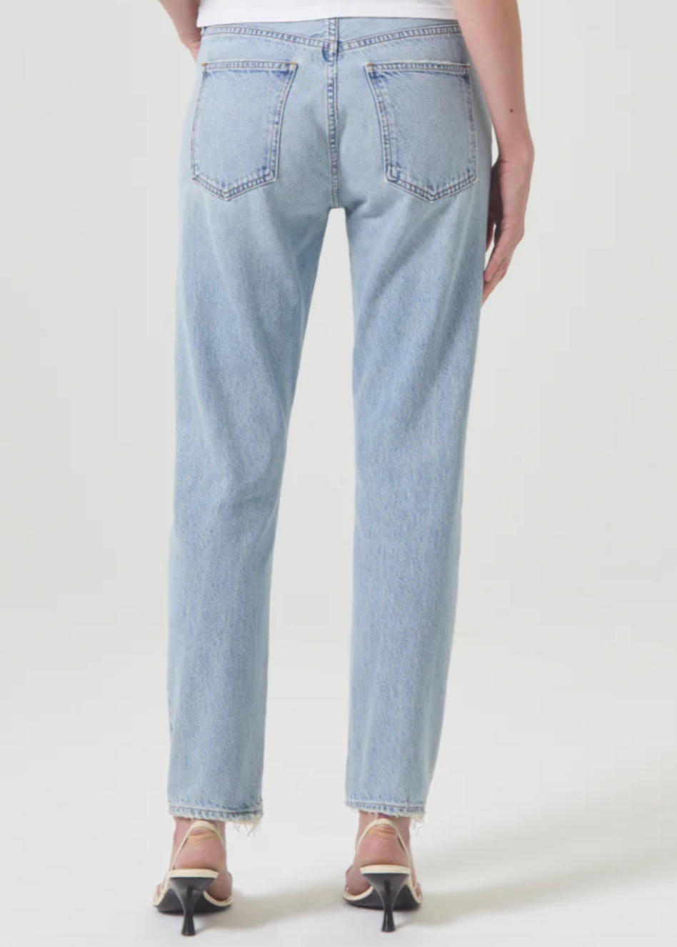 Person wearing AGOLDE Denim Austin Mid-Rise Tapered Slim Jean