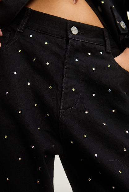 Person wearing Alemais Simona Mid Rise Denim Jean Crystal Embellished