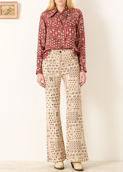 Person wearing Alix of Bohemia FW25-DOL106-Scopy Dolly Saddle Panel Bandana Silk Shirt