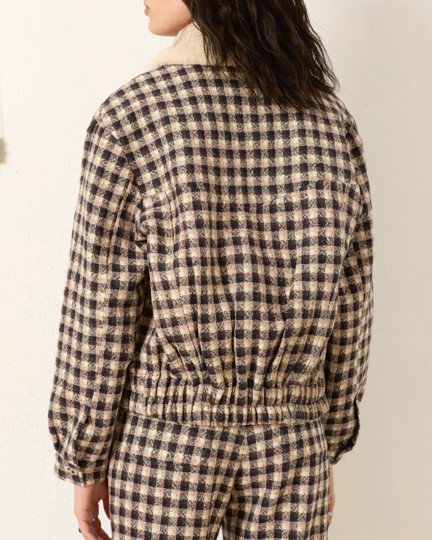 Person wearing Alix of Bohemia FW25 EliTrailDustBomberJacket