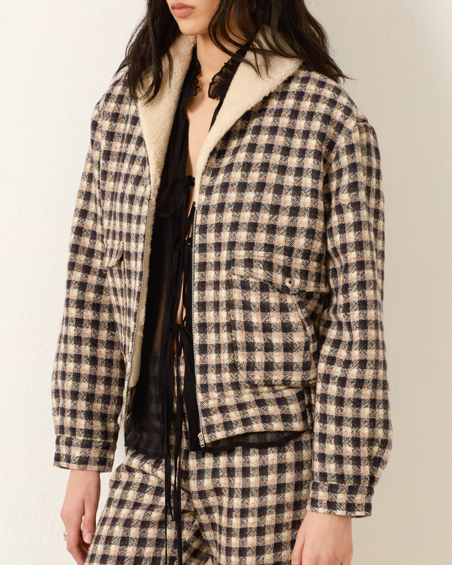 Person wearing Alix of Bohemia FW25 EliTrailDustBomberJacket