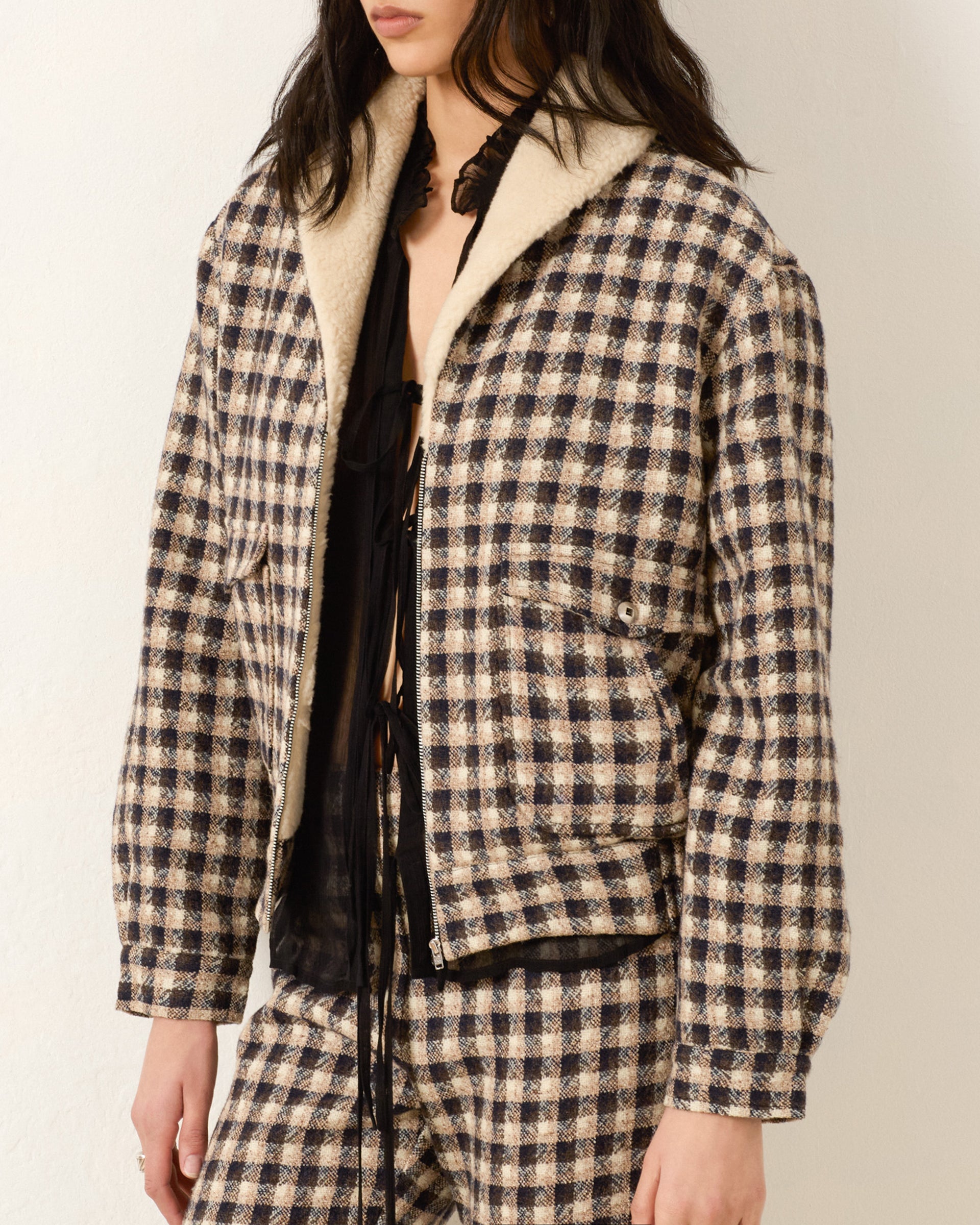 Person wearing Alix of Bohemia FW25 EliTrailDustBomberJacket