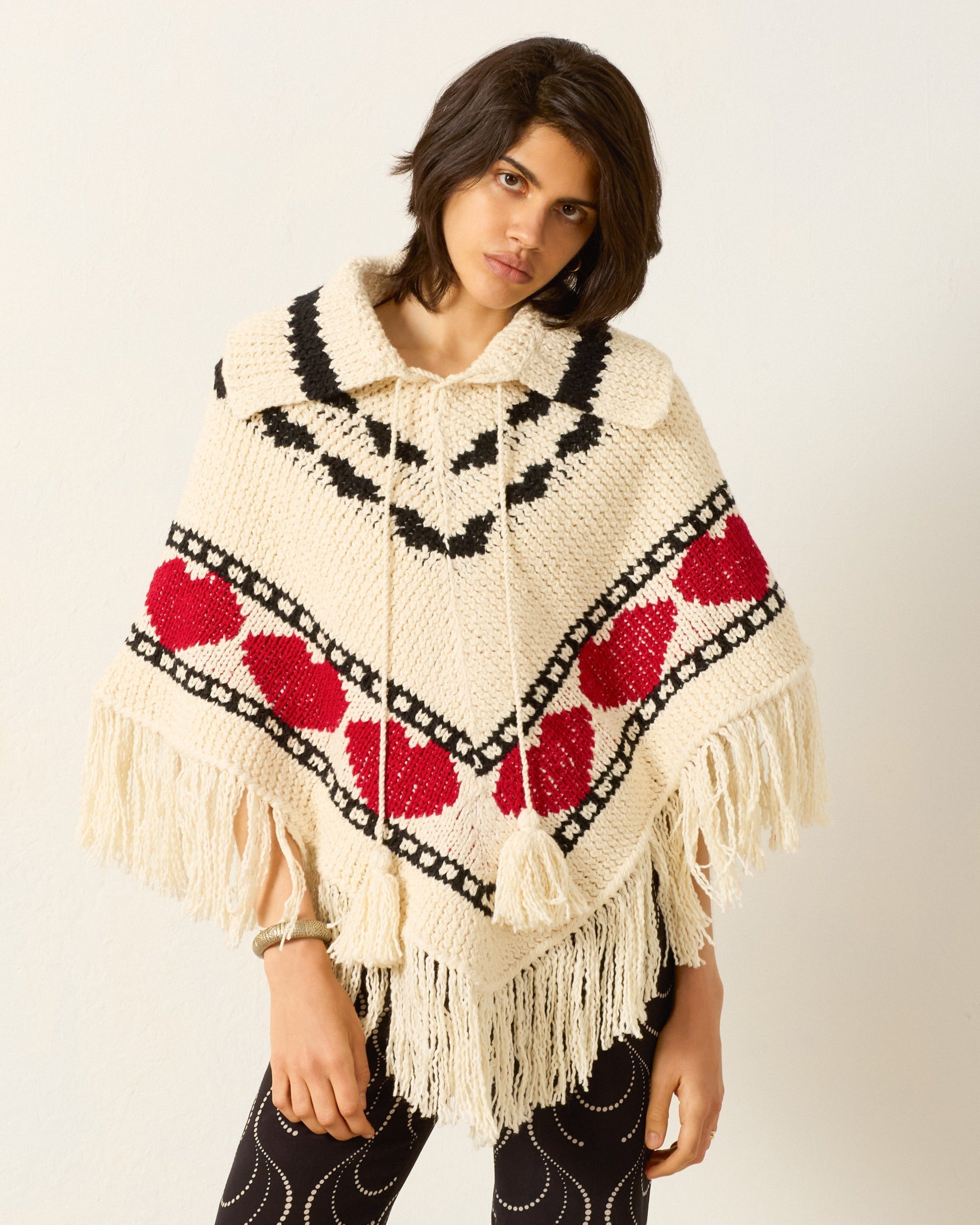 Person wearing Alix of Bohemia Faune Heart Knit Poncho
