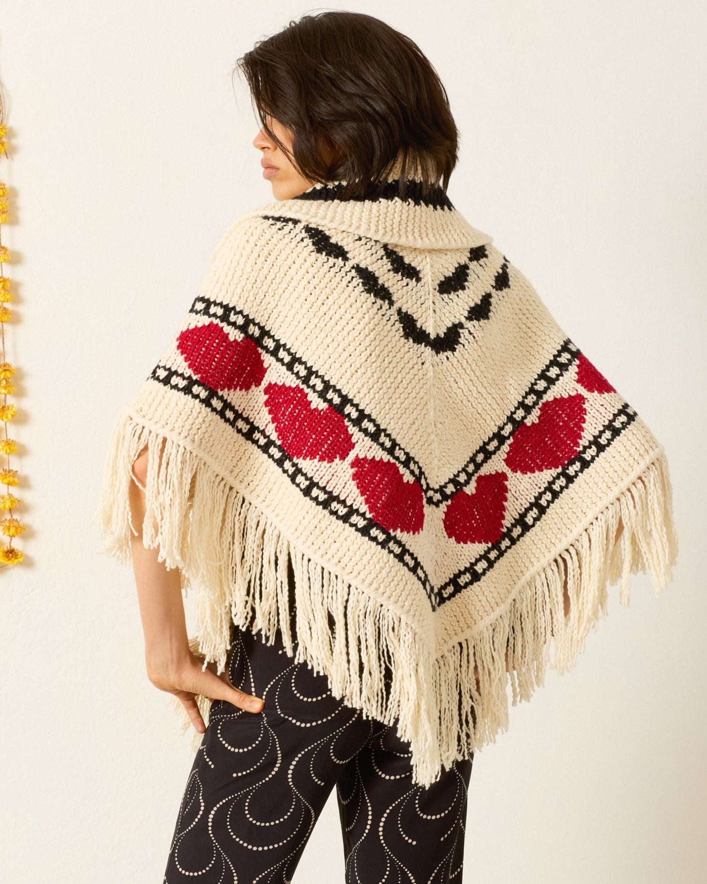 Person wearing Alix of Bohemia Faune Heart Knit Poncho