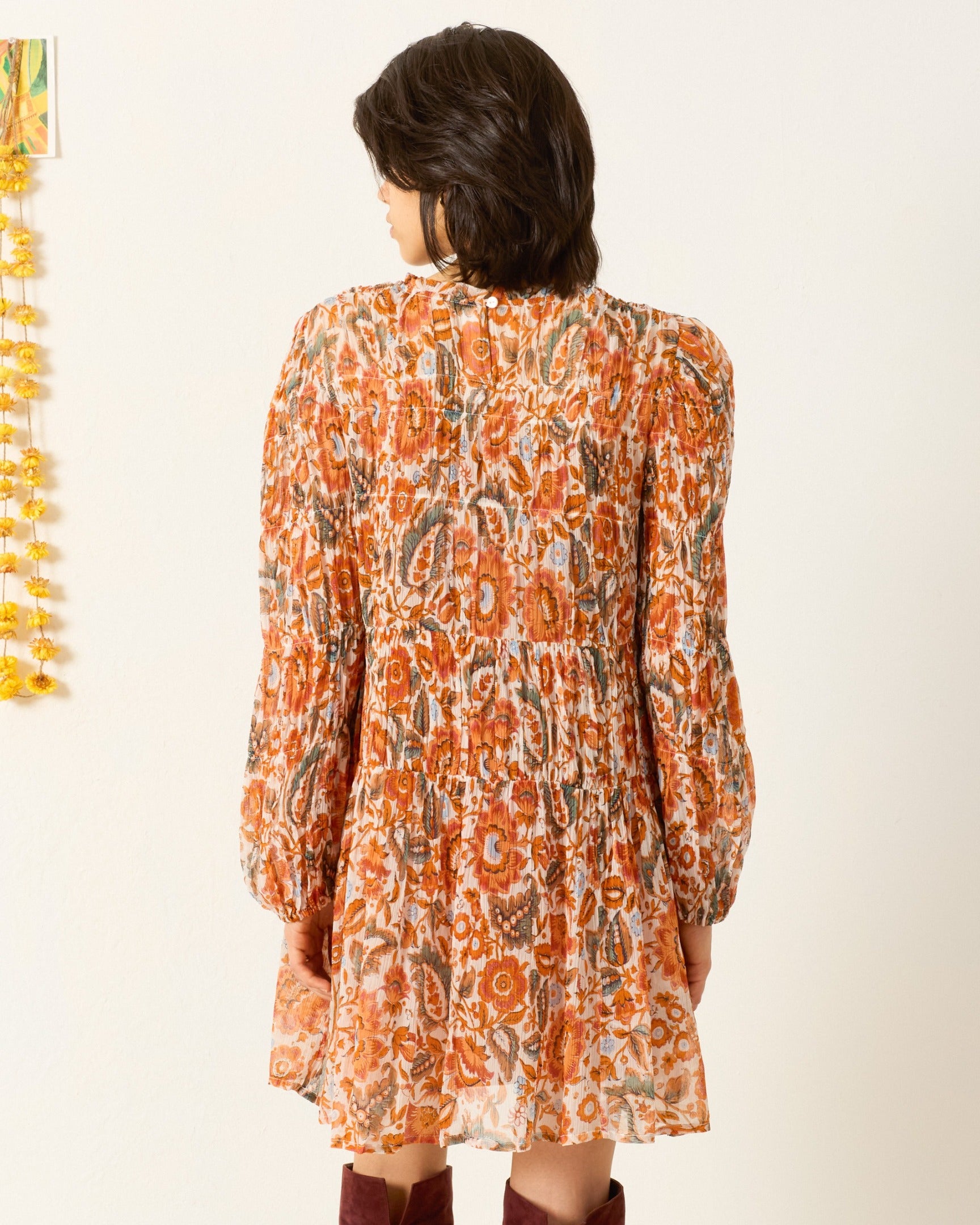 Person wearing Alix of Bohemia Juno Topaz Flower Dress