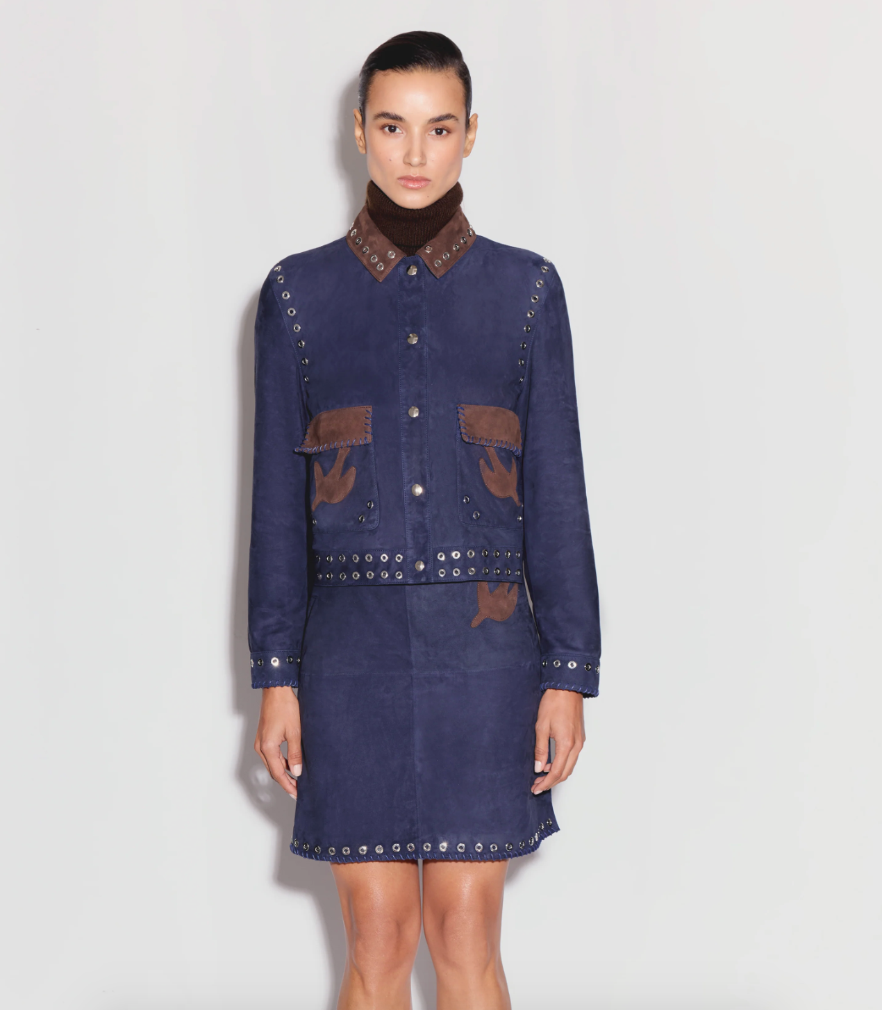 Person wearing Anim womens MAVEN navy Collared Suede Jacket With Pockets, Embroidery AND Grommet Details