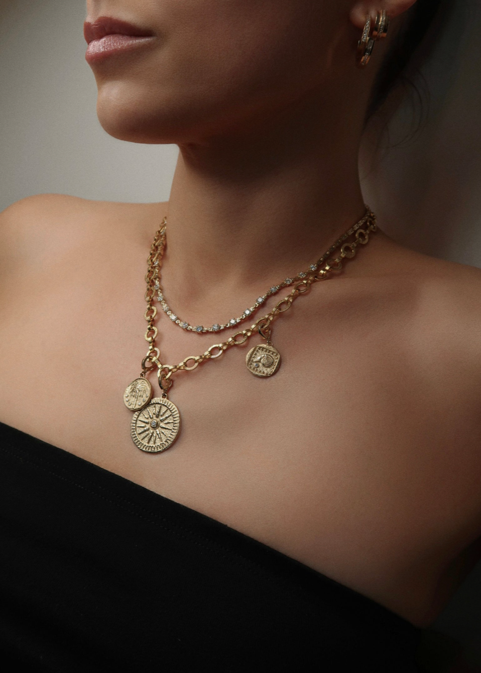 Person wearing Azlee 18k yellow gold Sunburst diamond charm