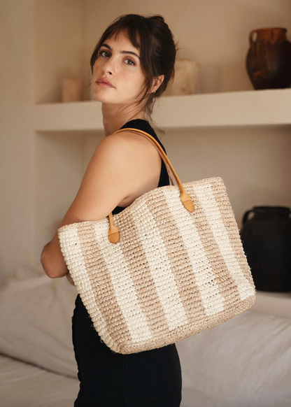 Person carrying BEMBIEN Woven Franci Bag in Cream Stripe on shoulder