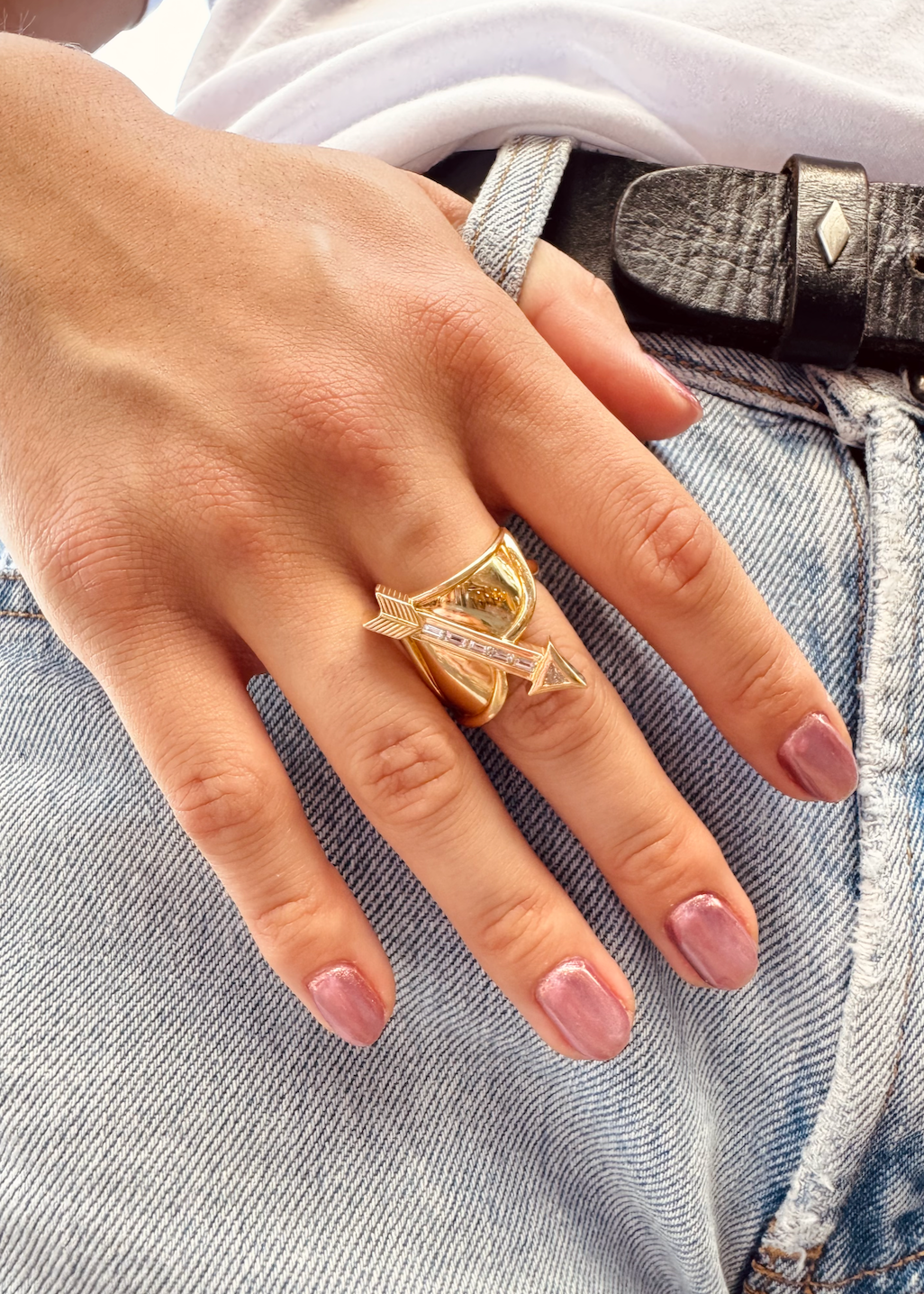 Person wearing Brent Neale fine jewelry 18k yellow gold diamond Sagittarius Zodiac Ring