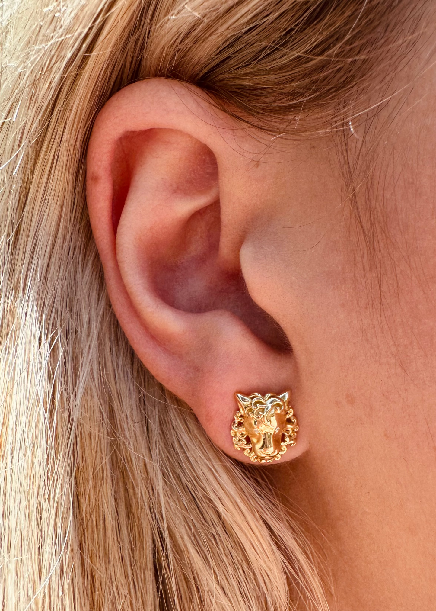Person wearing Brent Neale fine jewelry 18k yellow gold diamond Zodiac Leo Studs