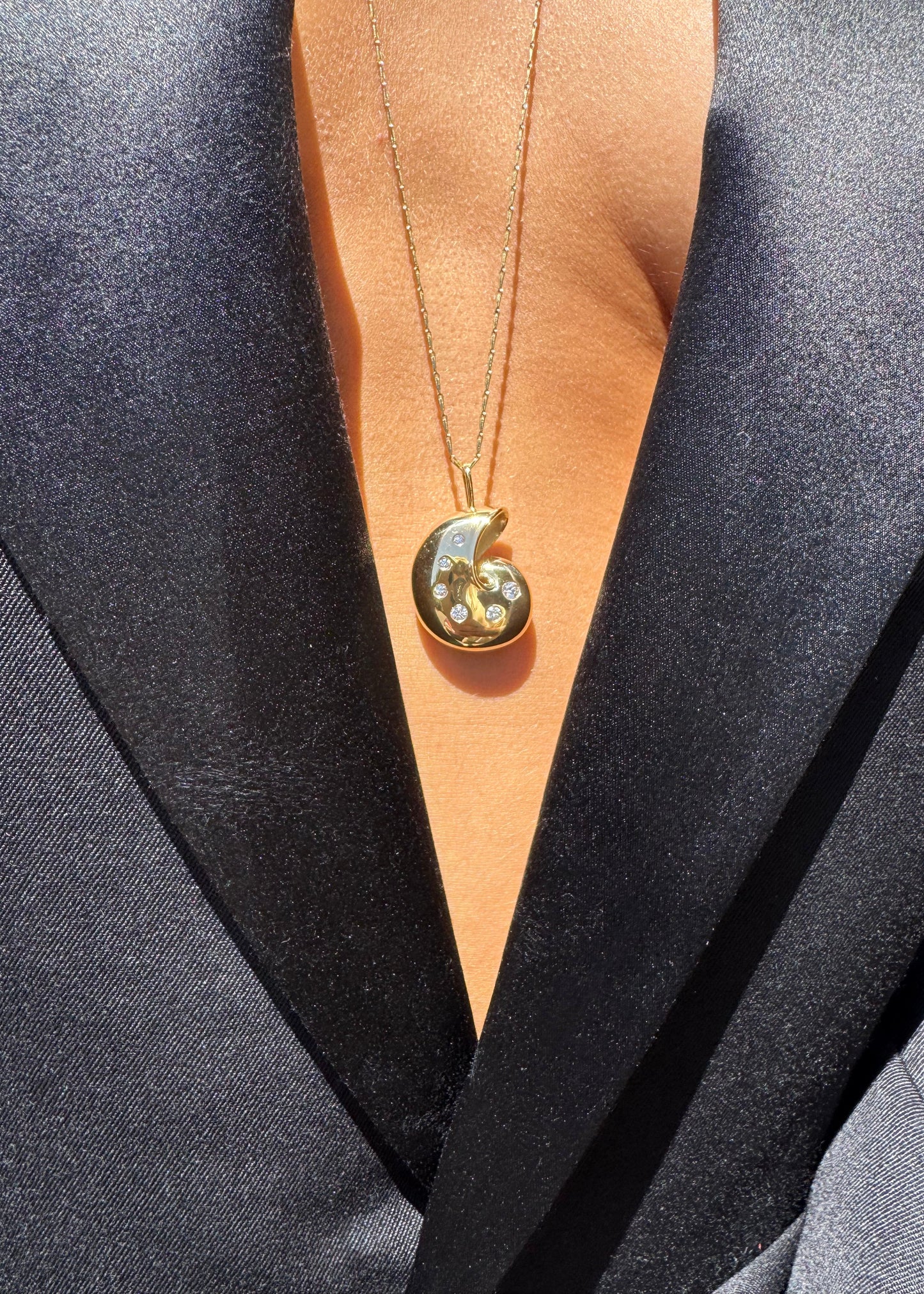 Person wearing Brent neale fine jewelry 18k yellow gold Small Nautilus Pendant Necklace with Diamonds
