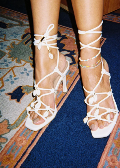 Person wearing Brother Vellies Shoreline Heeled Sandal in Ivory