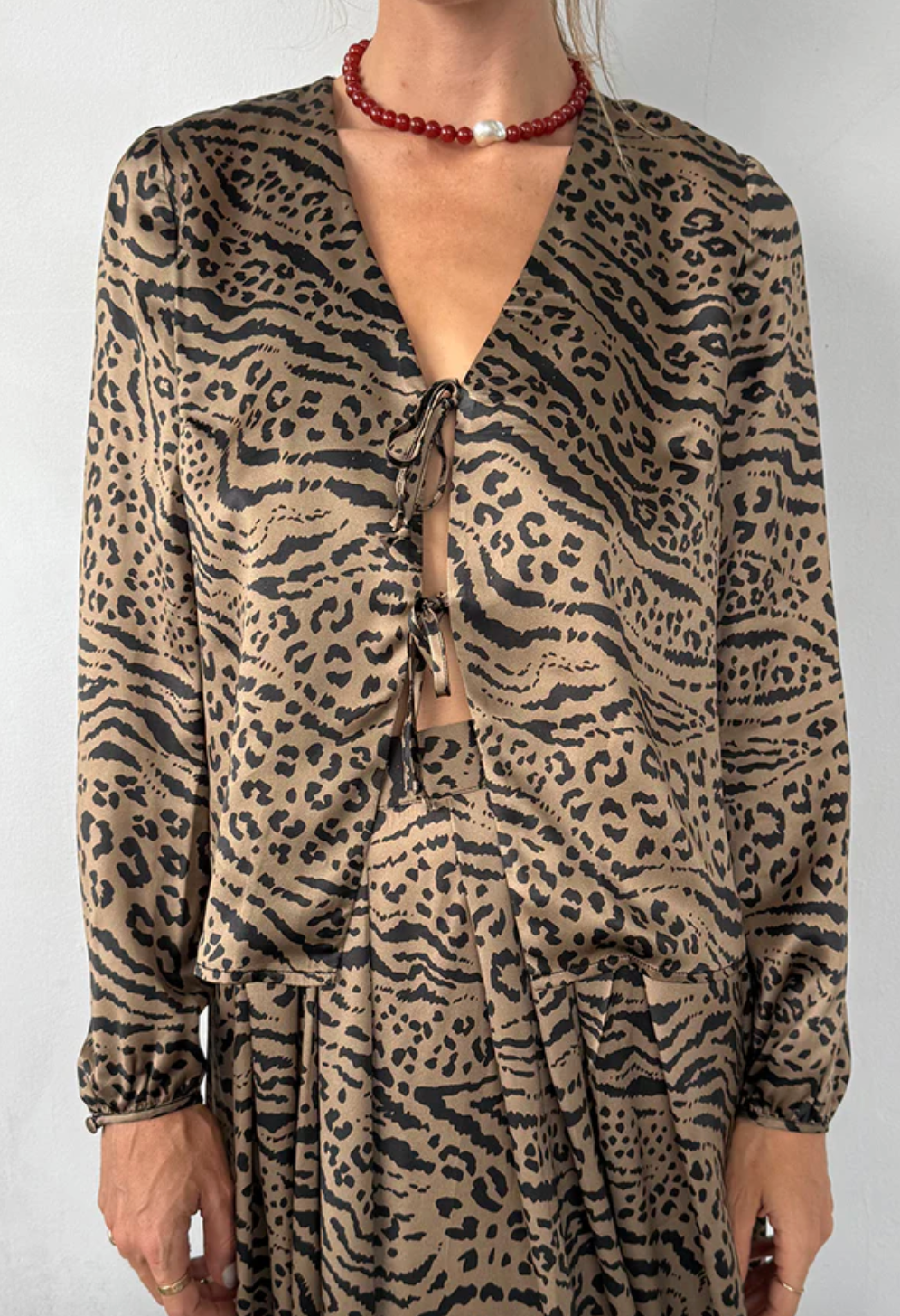 Person wearing CIao Lucia Pia Top in Leopard Silk