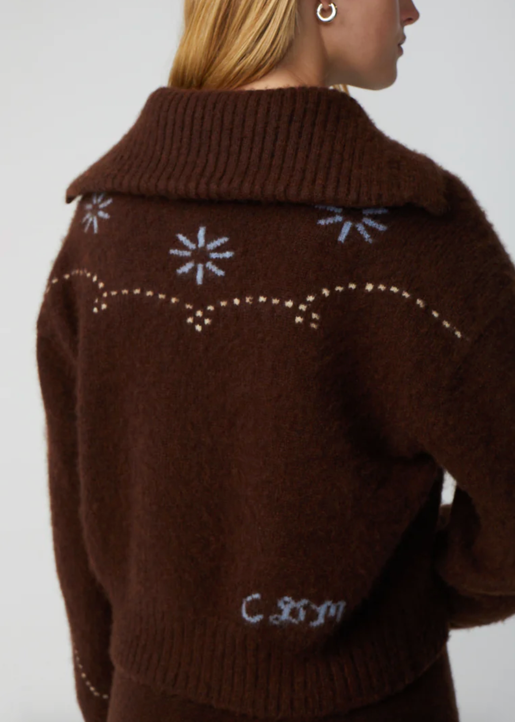 Person wearing Calle del Mar Western Cashmere Cardigan in Chocolate