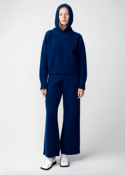 Person wearing Calle del Mar womens Cashmere Hoodie and Pants in Navy Blue