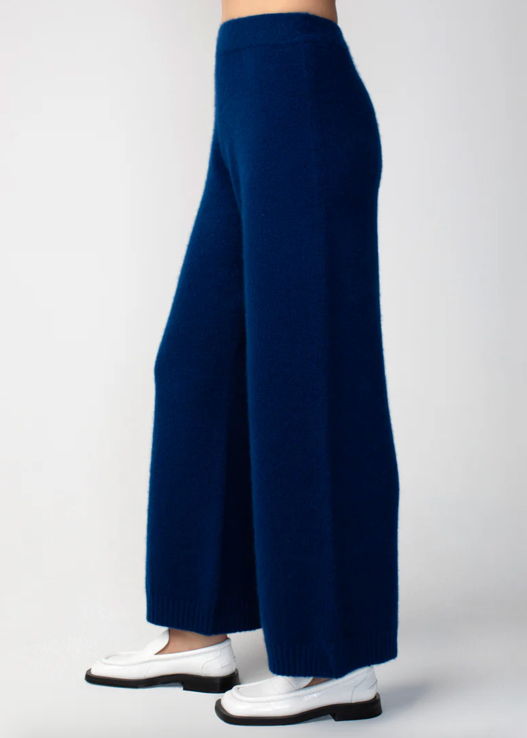Person wearing Calle del Mar womens Cashmere Pants in Navy Blue