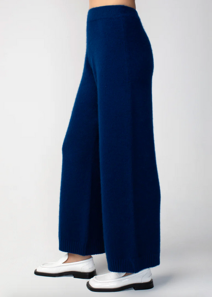 Person wearing Calle del Mar womens Cashmere Pants in Navy Blue