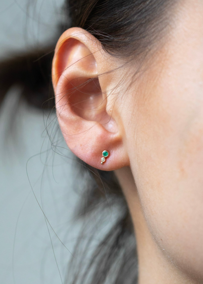 Person wearing Celine Daoust 14k yellow gold Emerald and Diamond Studs