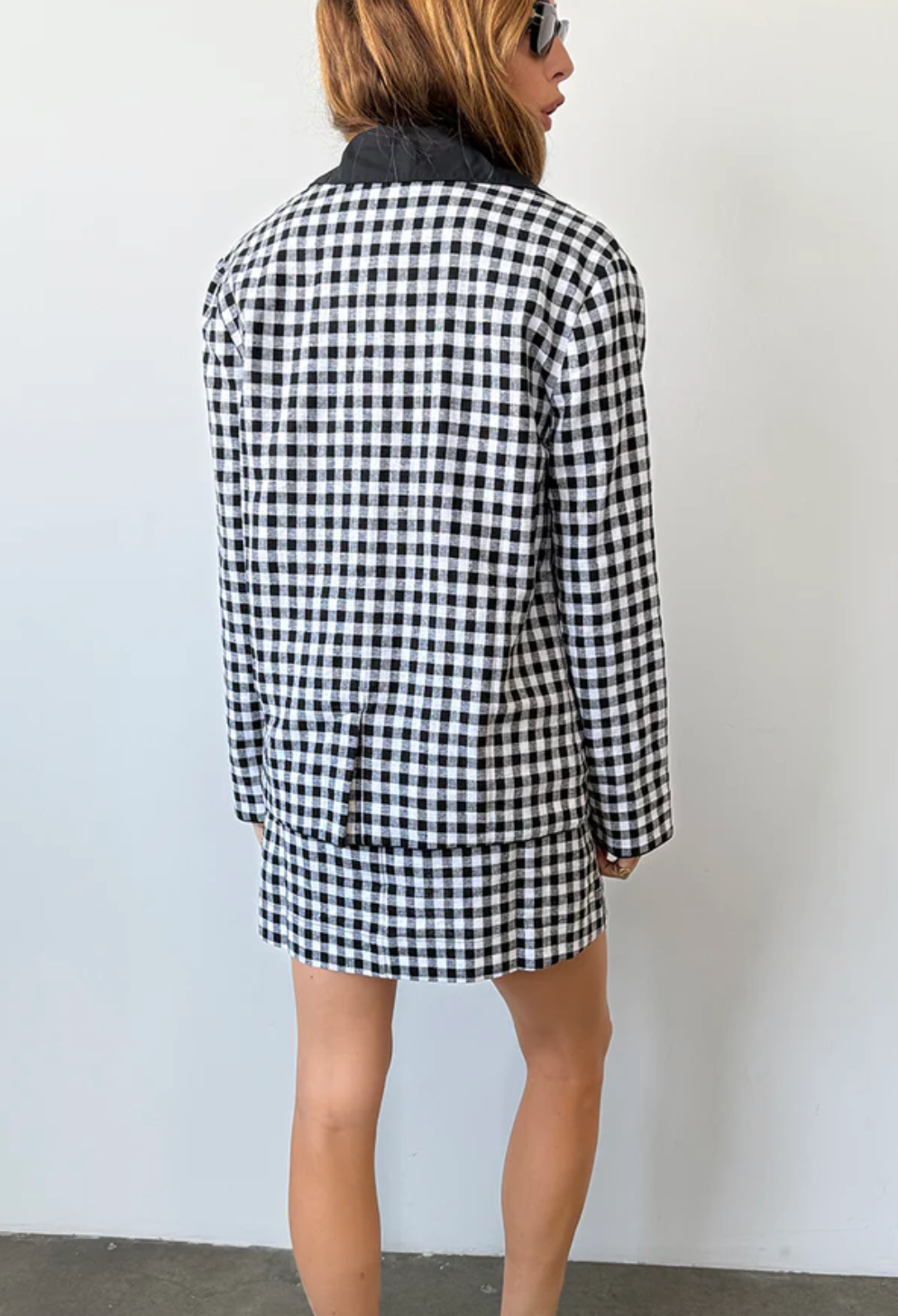 Person wearing Ciao Lucia Anja Gingham Jacket