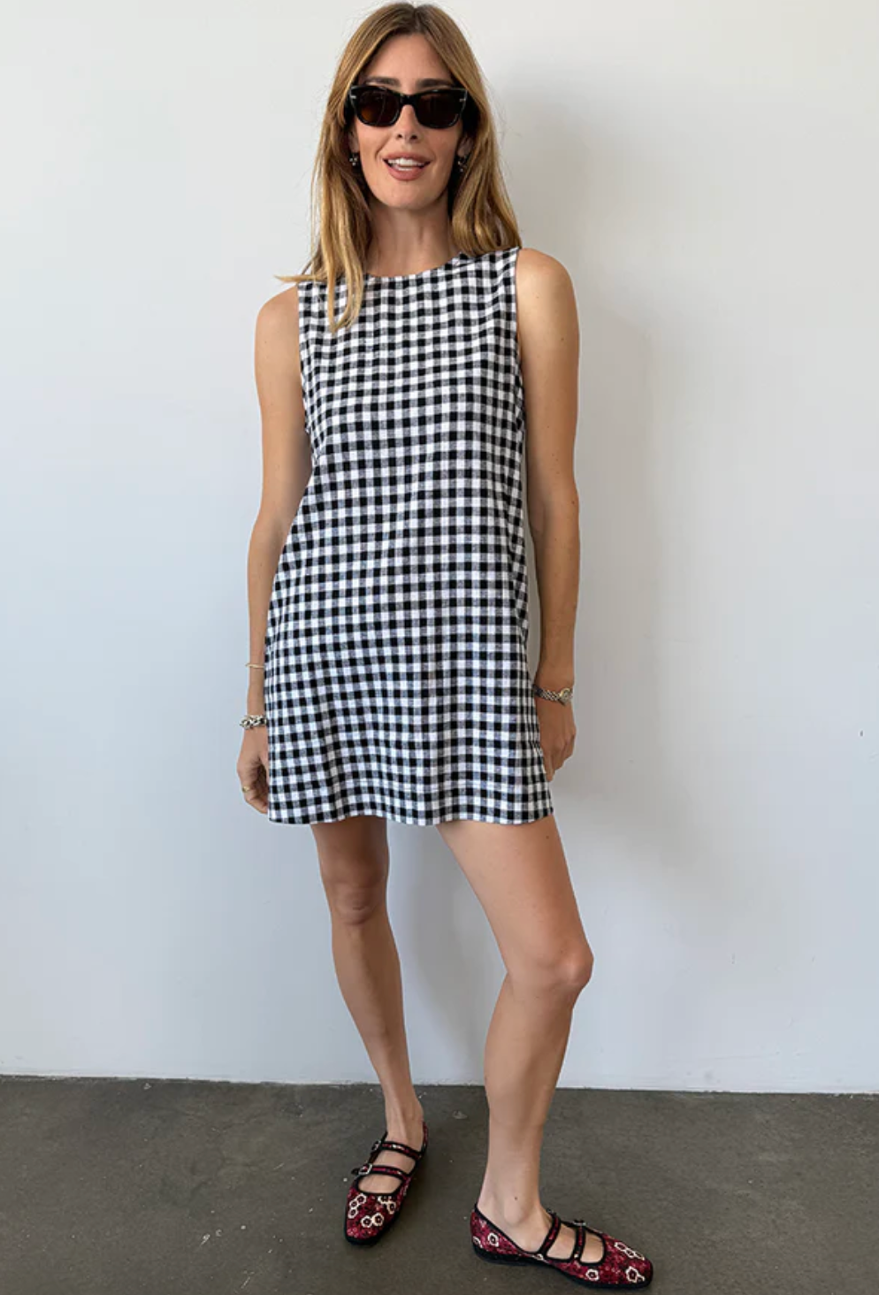 Person wearing Ciao Lucia Indus Gingham Dress Black and White