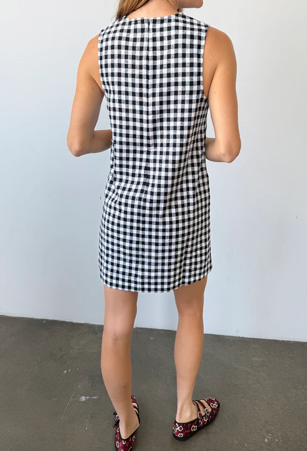 Person wearing Ciao Lucia Indus Gingham Dress Black and White