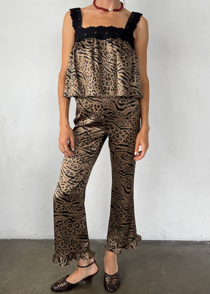 Person wearing Ciao Lucia Kaja Pants in Leopard Silk