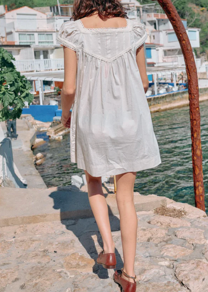 Person wearing Ciao Lucia Women's Brynn Cotton Poplin Dress in Ivory