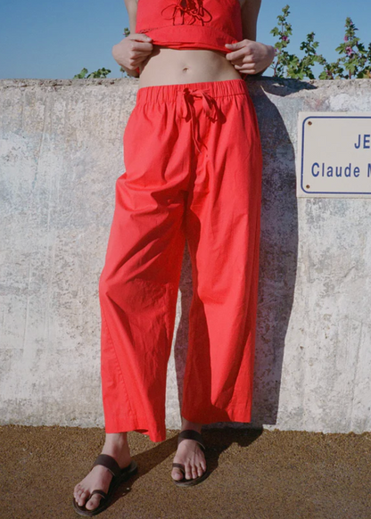 Person wearing Ciao Lucia Women's Dania Cotton Poplin Pant in Red