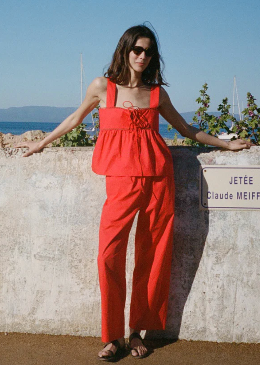 Person wearing Ciao Lucia Women's Dania Cotton Poplin Pant in Red