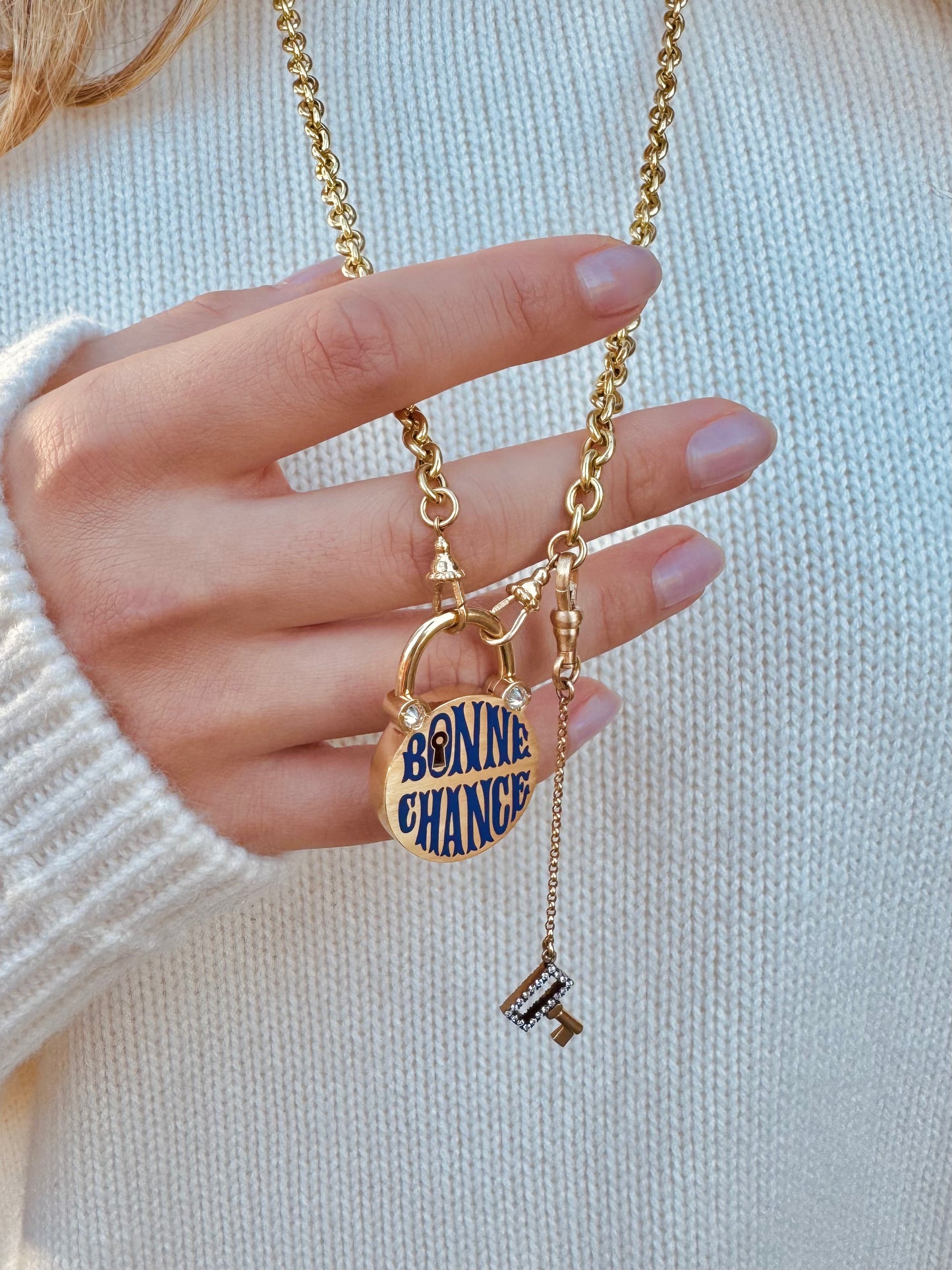 Person wearing Circa 1700 fine jewelry 18k yellow gold Bonne Chance Padlock Pendant