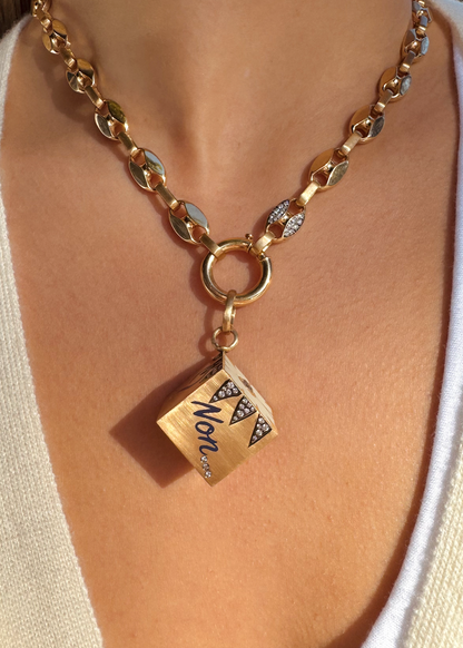 Person wearing Circa 1700 fine jewelry 18k yellow gold Chunky Mariner Knife Edge Link Chain with diamonds with spinnin the dice XL pendant