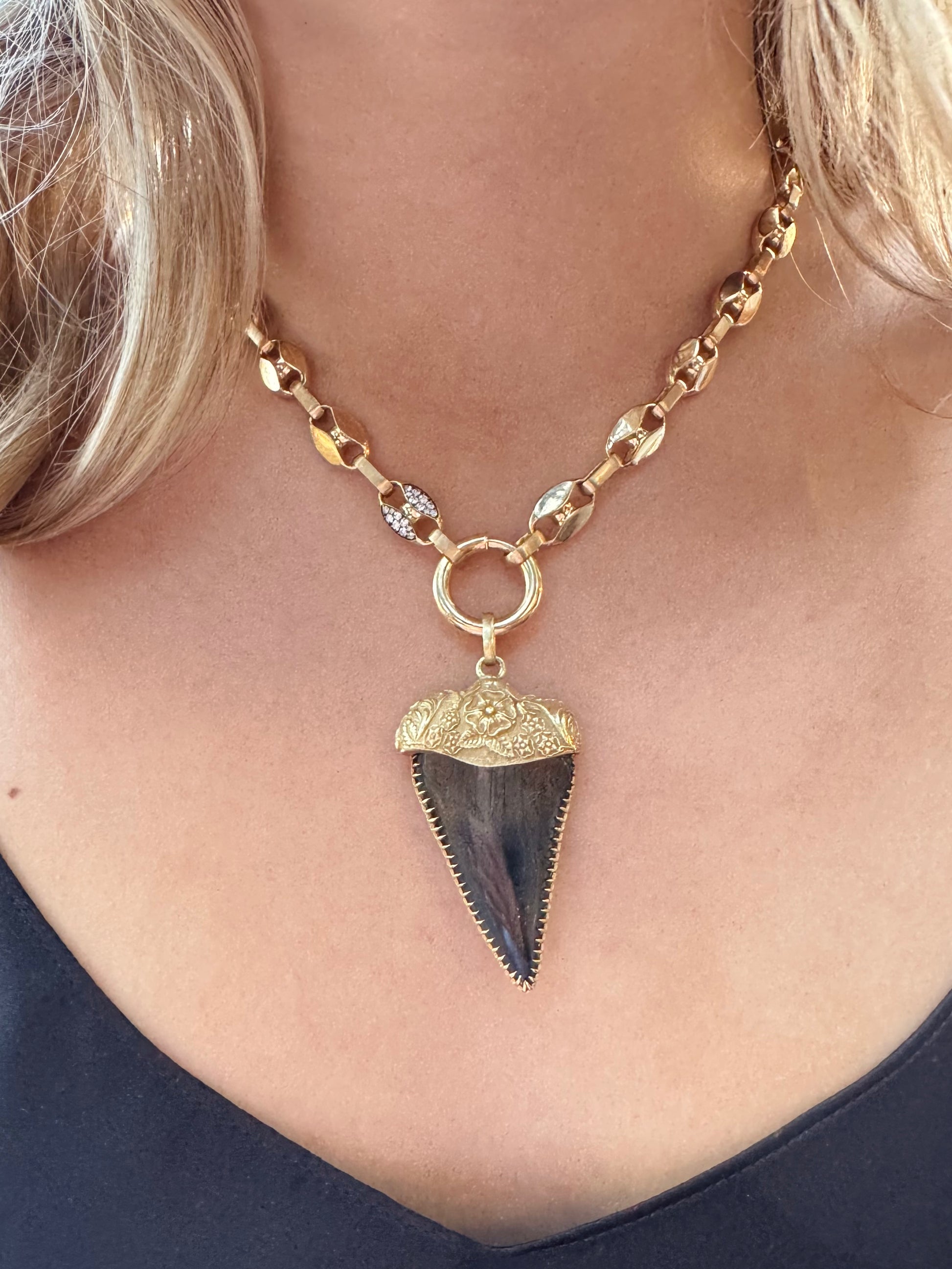 Person wearing Circa 1700 fine jewelry 18k yellow gold Love Token Fossilized Shark Tooth Talisman Pendant