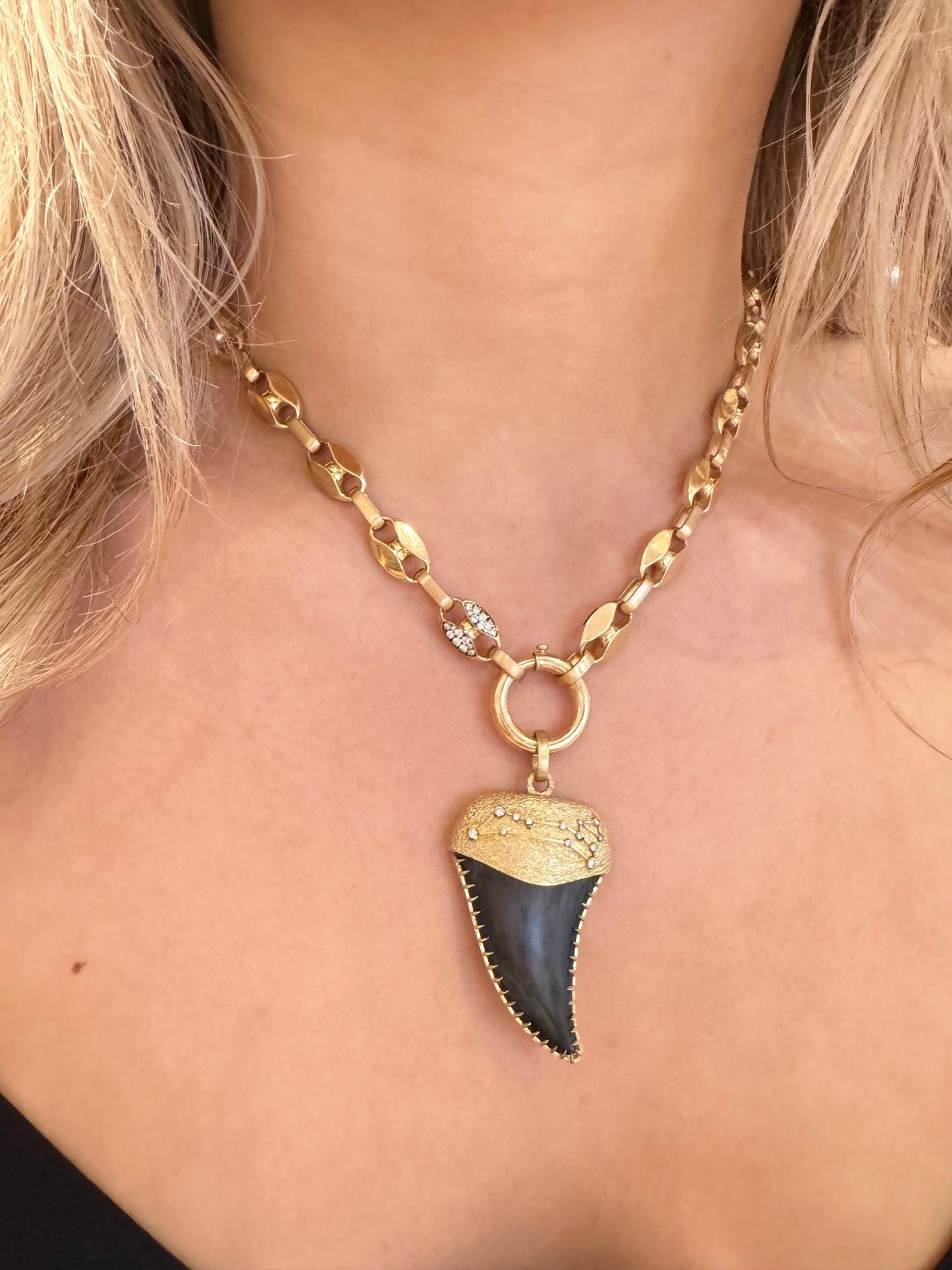 Person wearing Circa 1700 fine jewelry 18k yellow gold diamond Leo Fossilized Shark Tooth Talisman Pendant