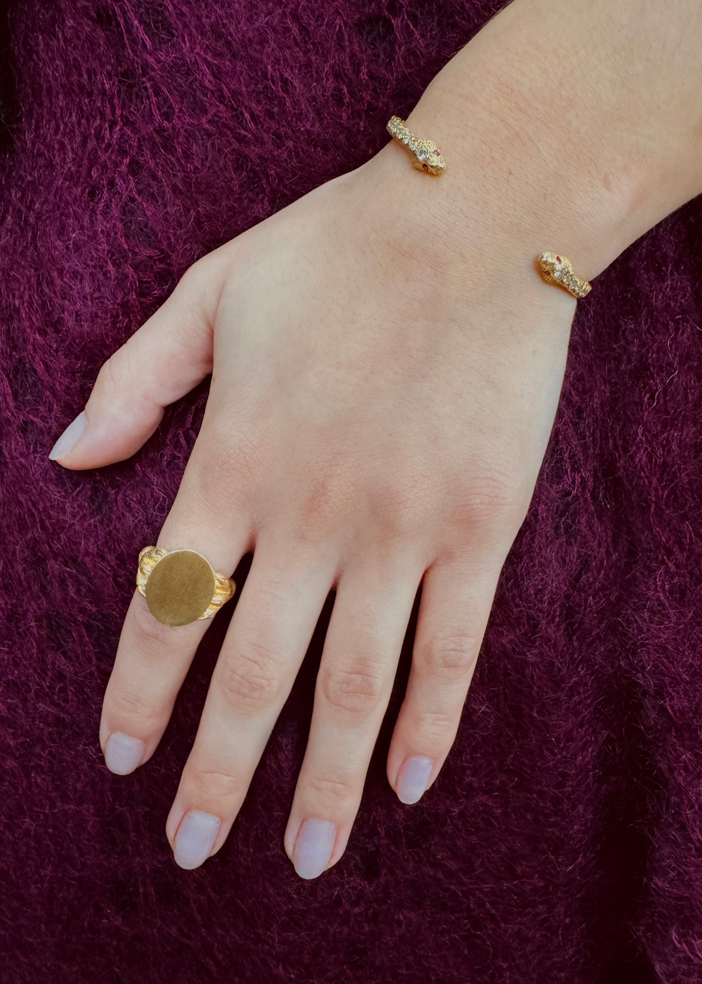 Person wearing Circa 1700 fine jewelry 18k yellow gold diamond ruby Eternal Love Toi et Moi Snake Cuff Bracelet