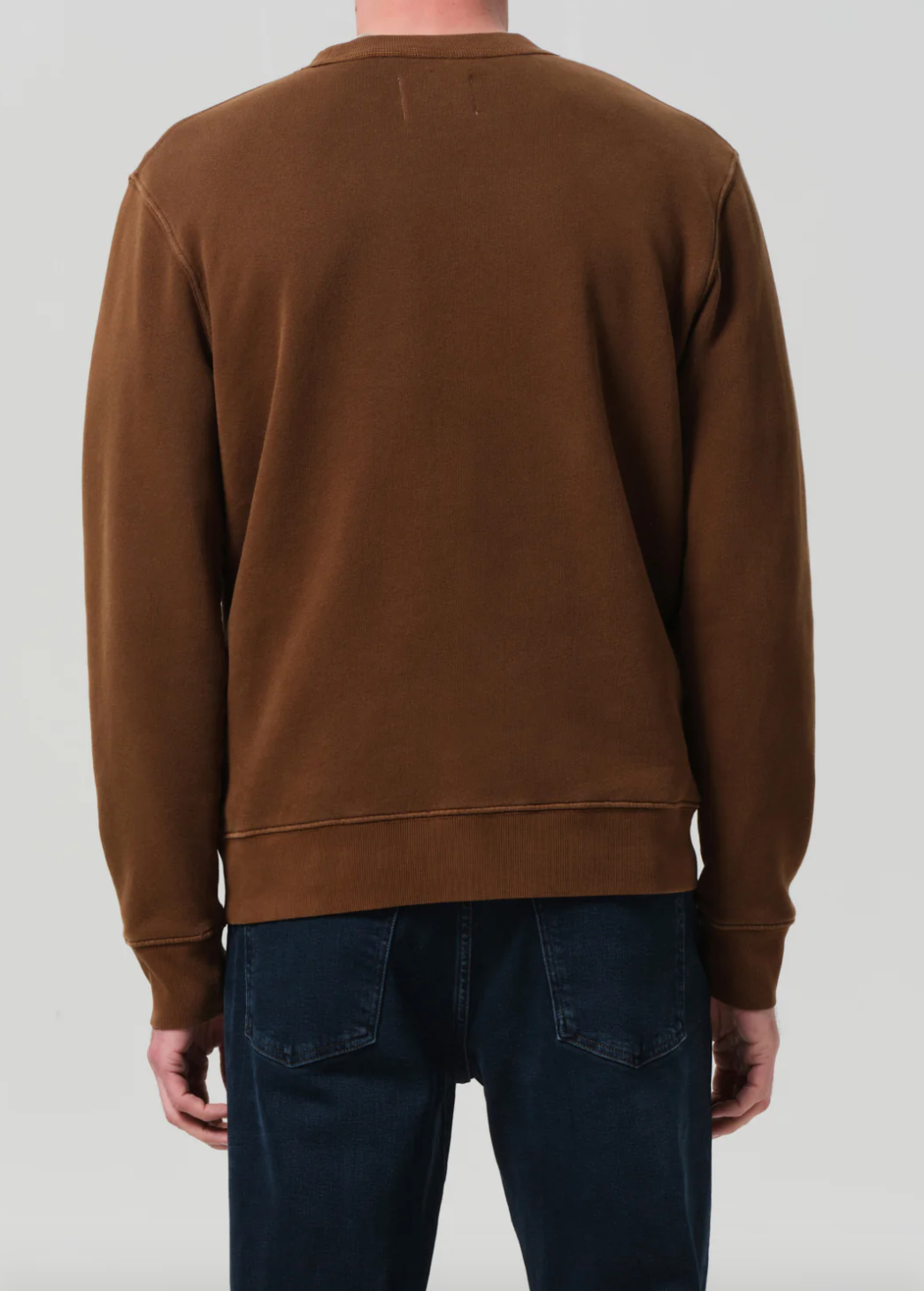 Person wearing Citizens of Humanity Men's Vintage Crewneck Sweatshirt in Copper
