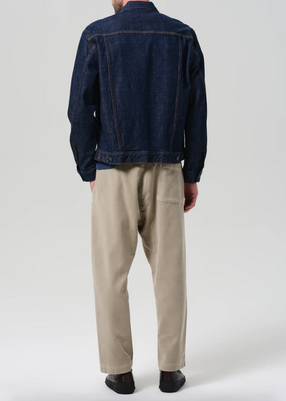 Person wearing Citizens of Humanity Mens The Aprés Pant in Vintage Stone