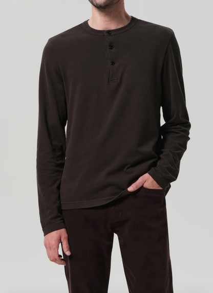 Person wearing Citizens of Humanity Mens Three Button Henley in Forest Green