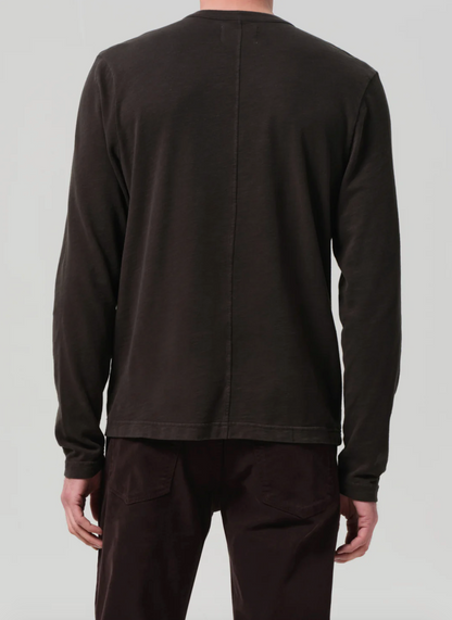 Person wearing Citizens of Humanity Mens Three Button Henley in Forest Green