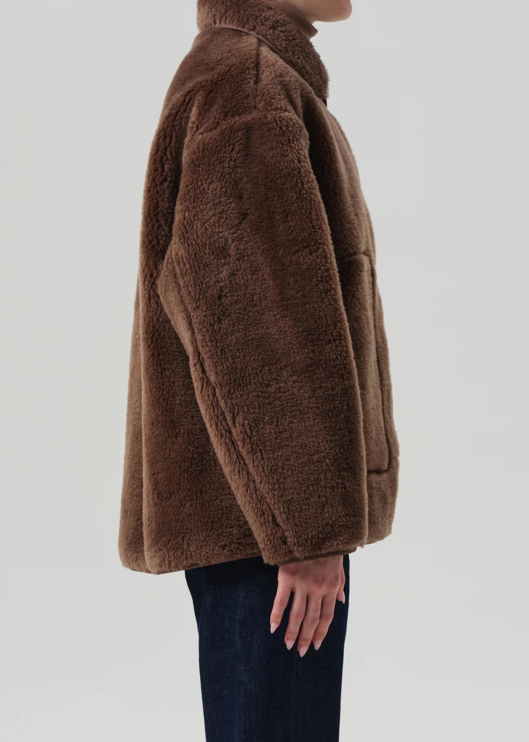 Person wearing Citizens of Humanity Womens Astrid Sherpa Jacket in Warm Tan