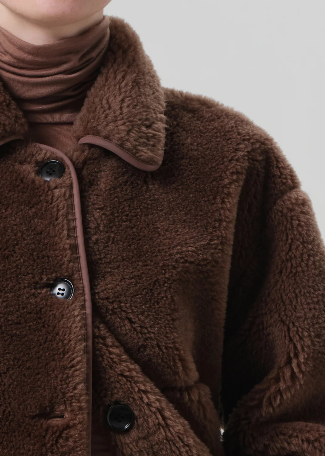 Person wearing Citizens of Humanity Womens Astrid Sherpa Jacket in Warm Tan