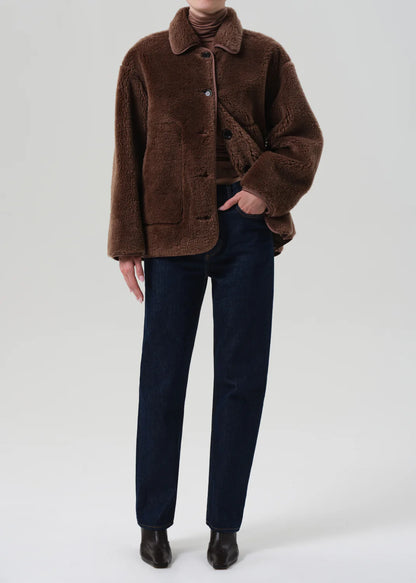 Person wearing Citizens of Humanity Womens Astrid Sherpa Jacket in Warm Tan