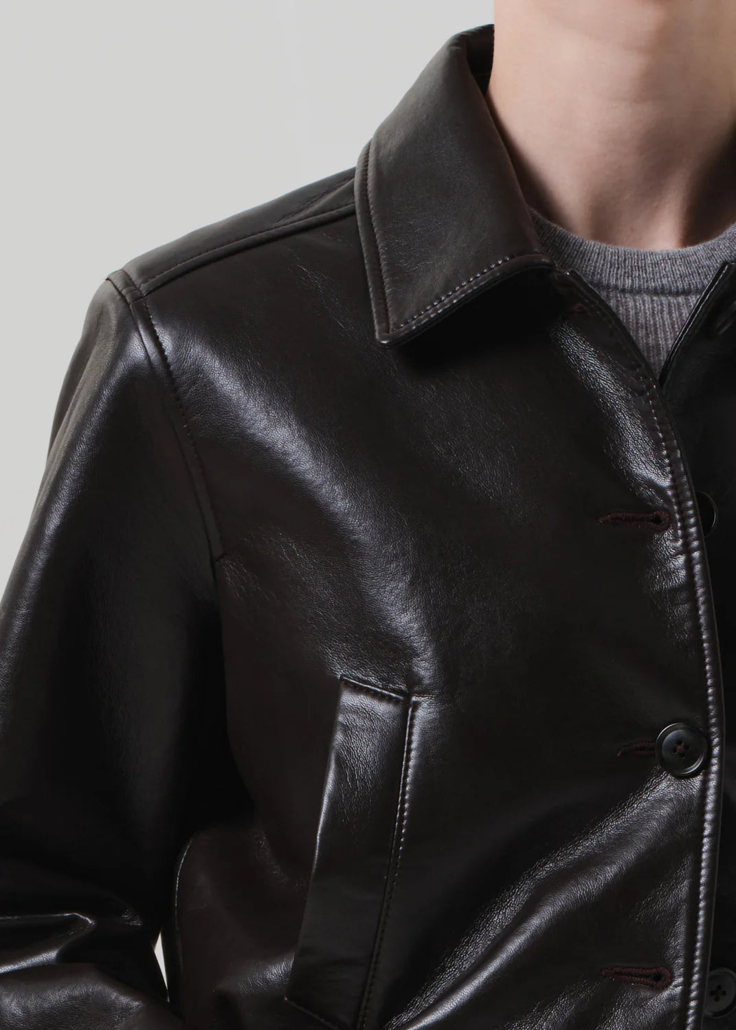 Person wearing Citizens of Humanity Womens Lola Leather Bomber in Dark Brown