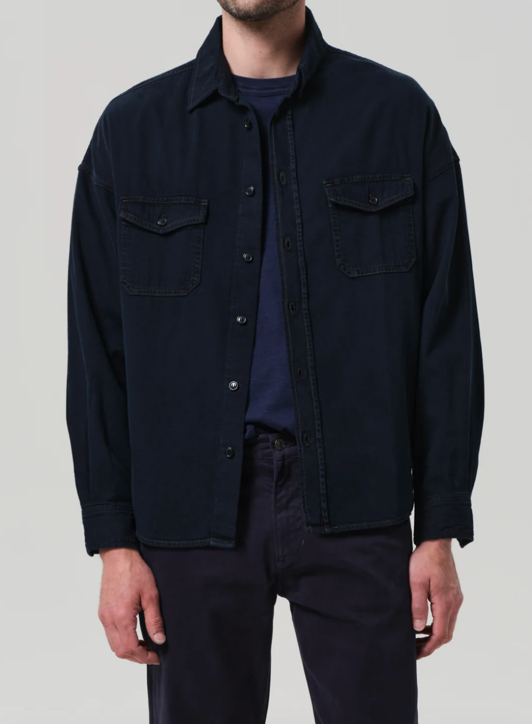 Person wearing Citizens of Humanity mens Shigoto Shirt Jacket in Dark Indigo