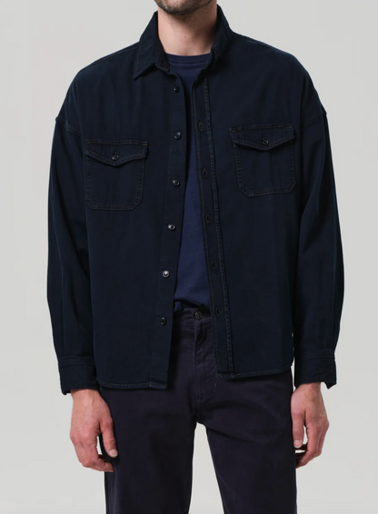 Person wearing Citizens of Humanity mens Shigoto Shirt Jacket in Dark Indigo