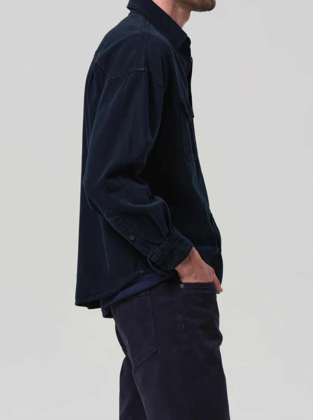 Person wearing Citizens of Humanity mens Shigoto Shirt Jacket in Dark Indigo