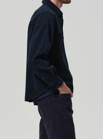 Person wearing Citizens of Humanity mens Shigoto Shirt Jacket in Dark Indigo