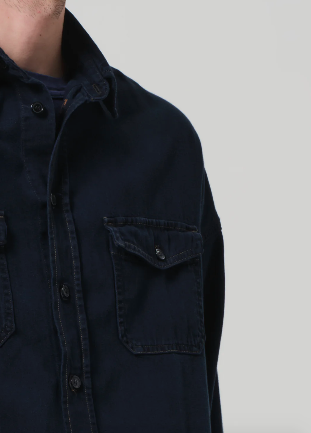 Person wearing Citizens of Humanity mens Shigoto Shirt Jacket in Dark Indigo
